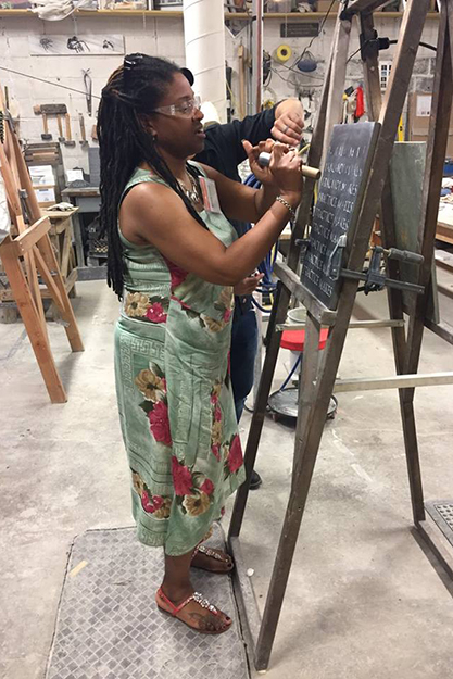A guest tries carving