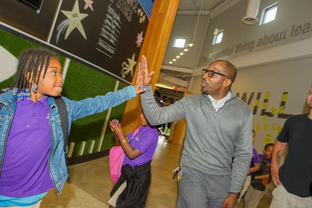 Living Classrooms students high fiving