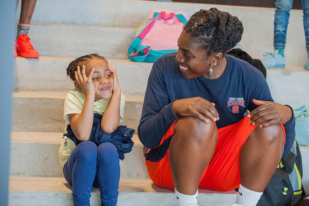 Rochelle Coleman '05 sits with a Living Classrooms student